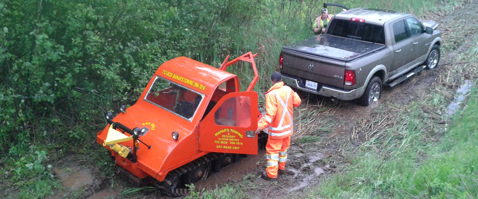 Track vehicle pulling truck